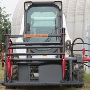 Close-up view of a skid steer loader with a skid steer attachment
